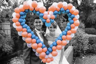 Bride and Groom with heart of balloons in slective colouring
